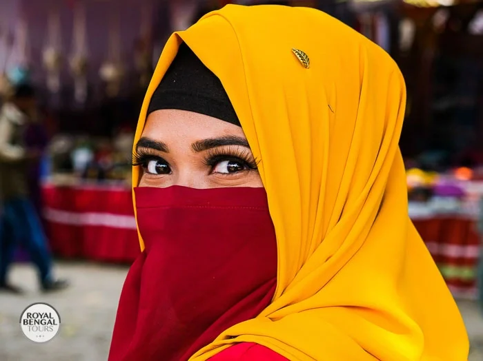 Woman in colorful Bangladeshi dress posing for a photo in Dhaka, Bangladesh