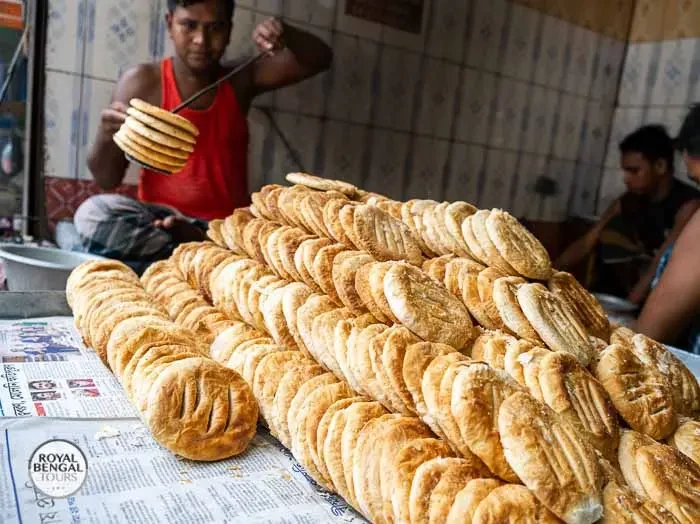 Baker making bagorkhani, a flaky flatbread, at a traditional bakery in Old Dhaka