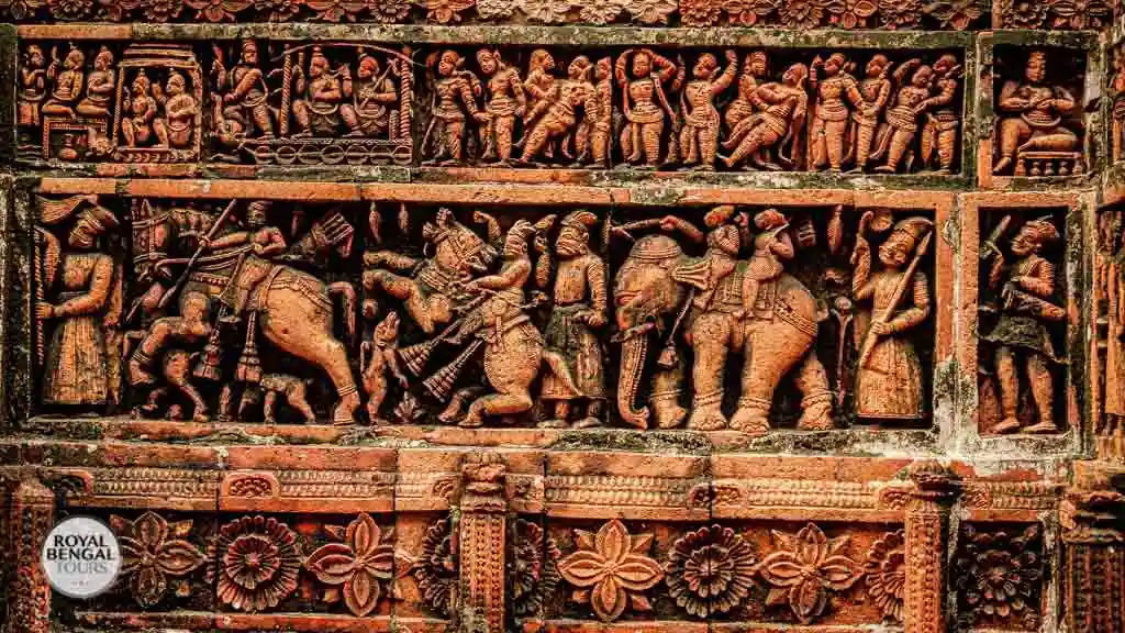 arched doorway of Kantaji Temple is framed by intricate terracotta panels depicting mythological tales