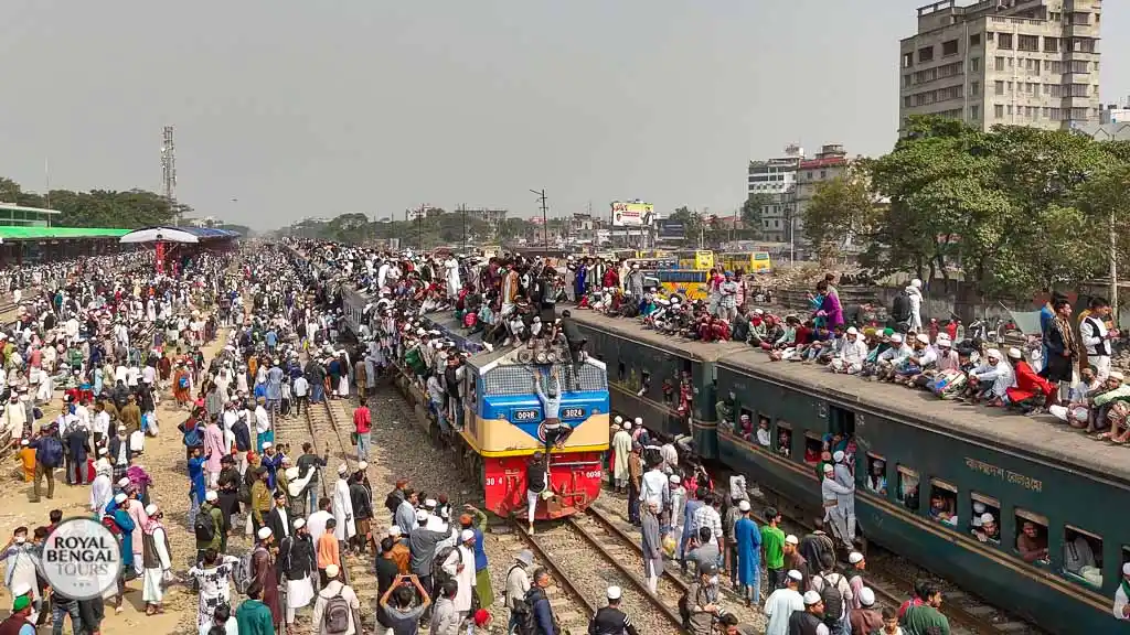 Pilgrims cling to the roof of an overcrowded train during the Ijtema in Bangladesh