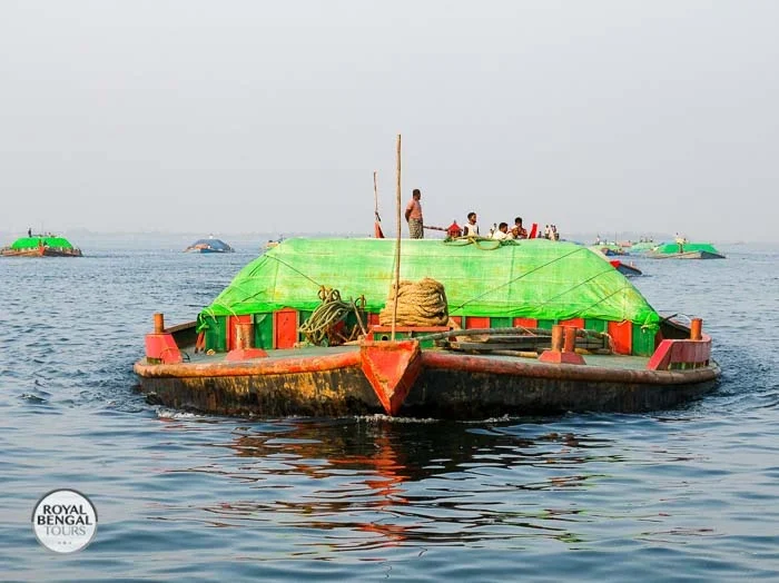 sand carrying boat looks like a submarine on meghna river in Bangladesh