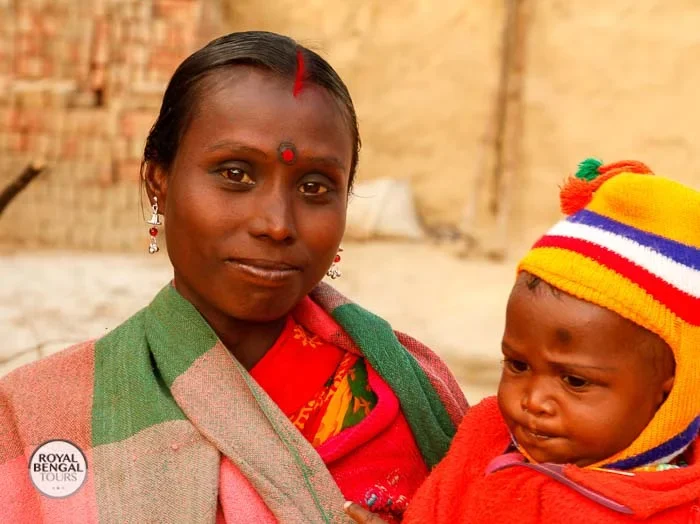 shantal tribal lady with her baby in rajshahi